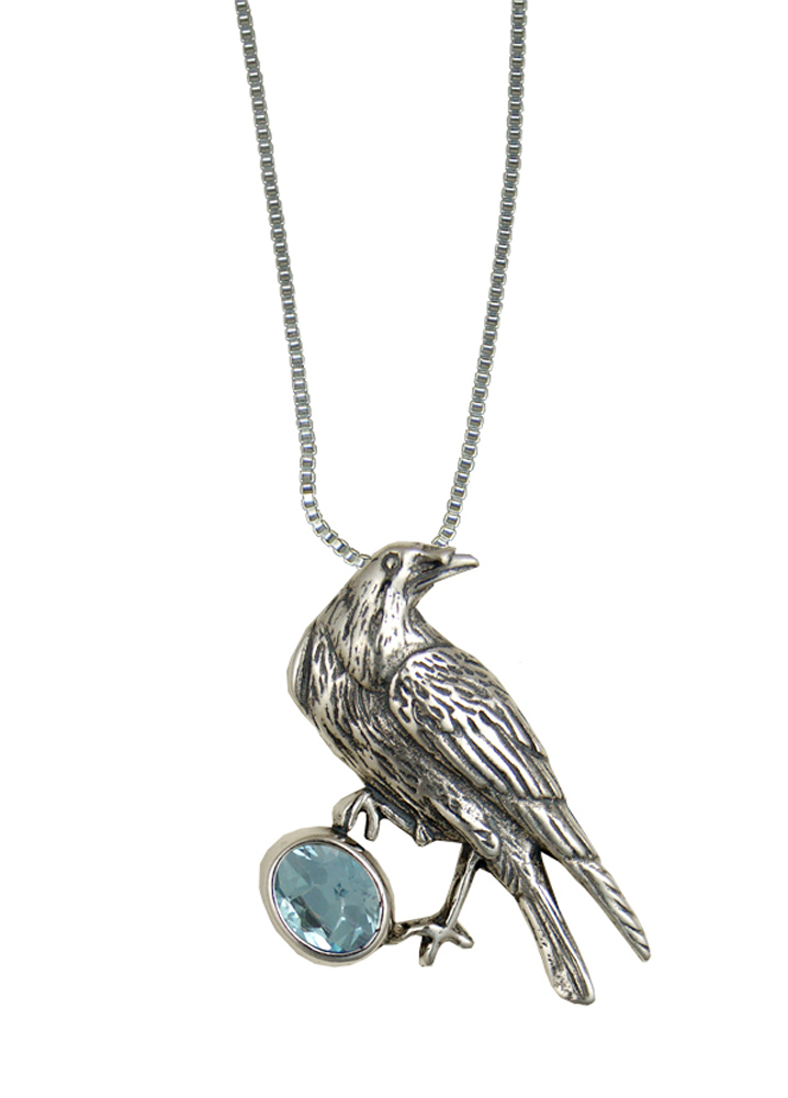 Sterling Silver Raven Pendant With Faceted Blue Topaz